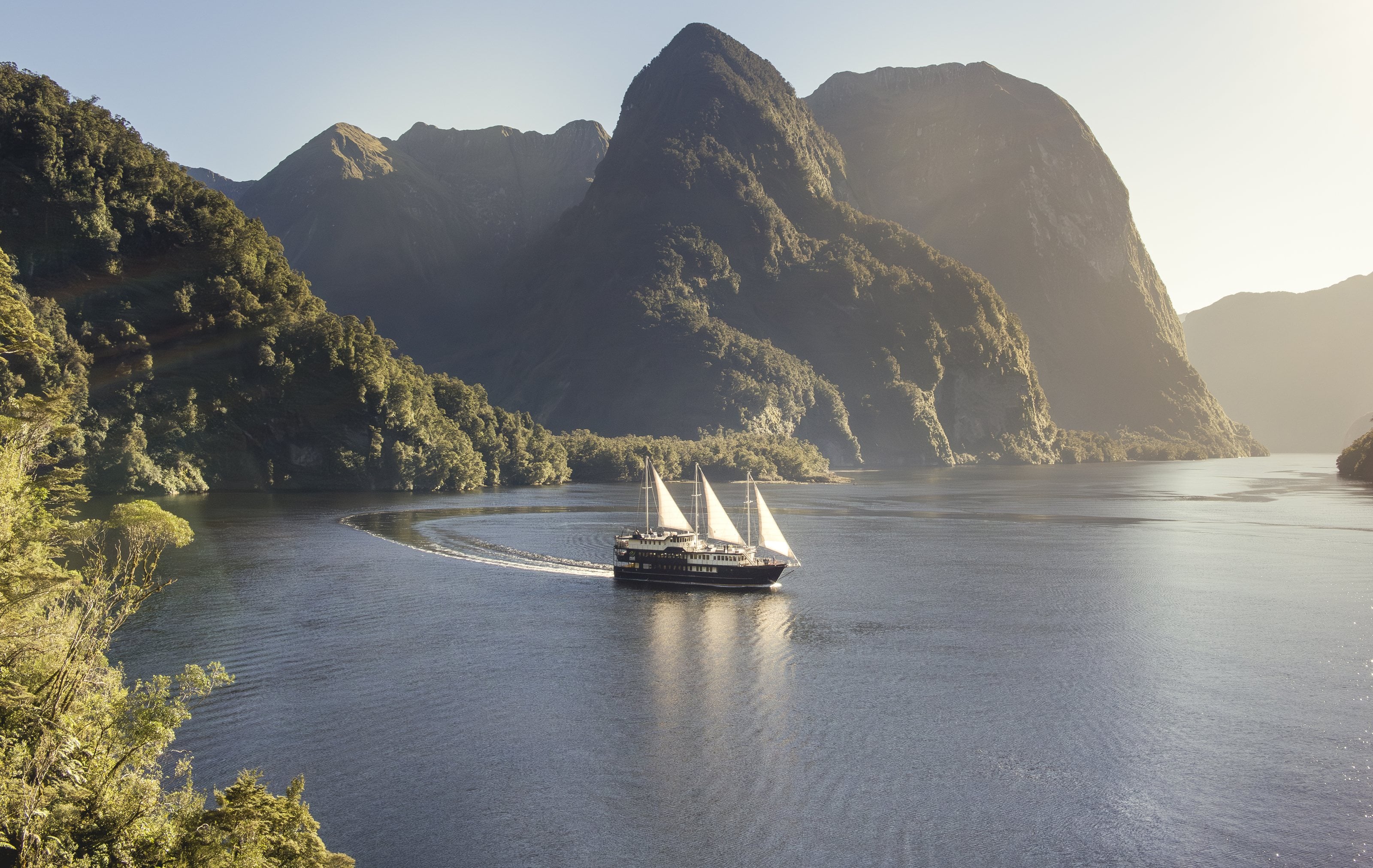 A ship under sail in the fiord, Fiordland