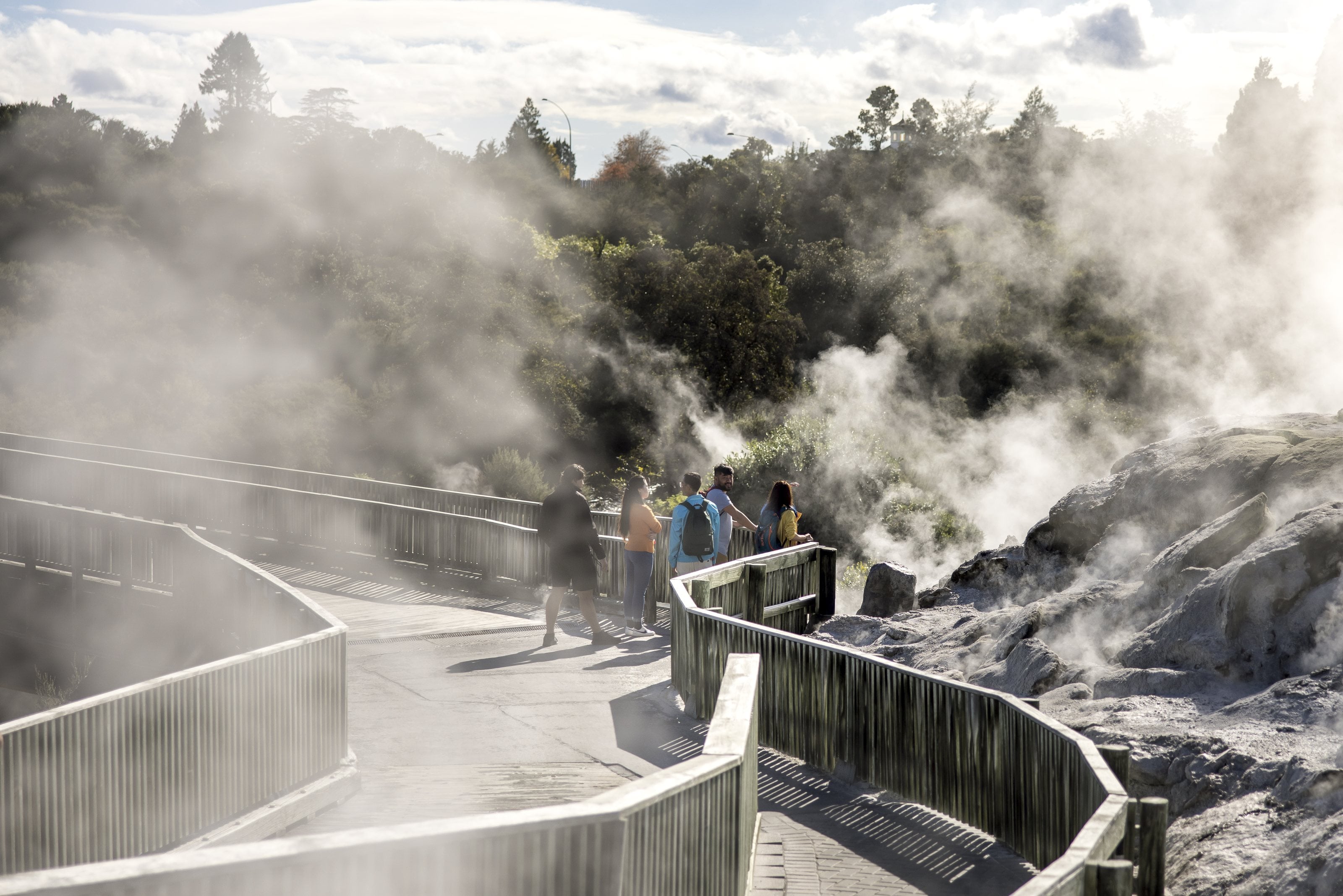 Steam rolling across a geothermal walkway in Rotorua